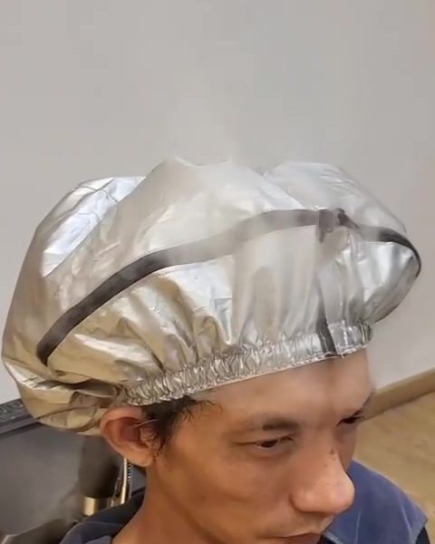 Guest wearing a steam cap during the herbal steam